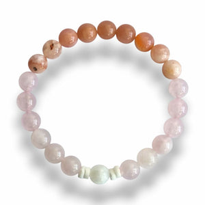 Handmade pink gemstone bracelet with shell slice spacers on stretch cord, 7.5 inch