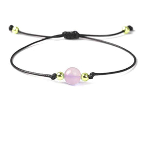 Rose quartz beaded bracelet in soft pink natural stone on a wax cord