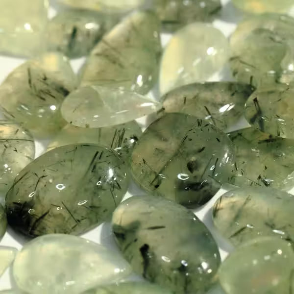 Natural Prehnite crystals and jewellery, pale apple green