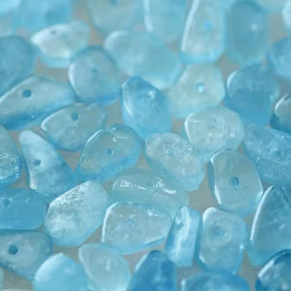 Natural Aquamarine crystals and jewellery, pale sky to sea blue