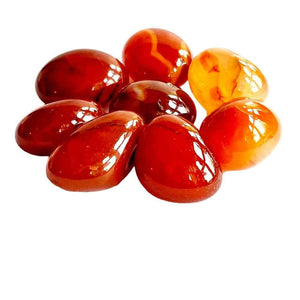 Carnelian polished tumblestone in warm orange-red natural stone