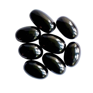Black obsidian polished tumblestone, glossy black volcanic glass