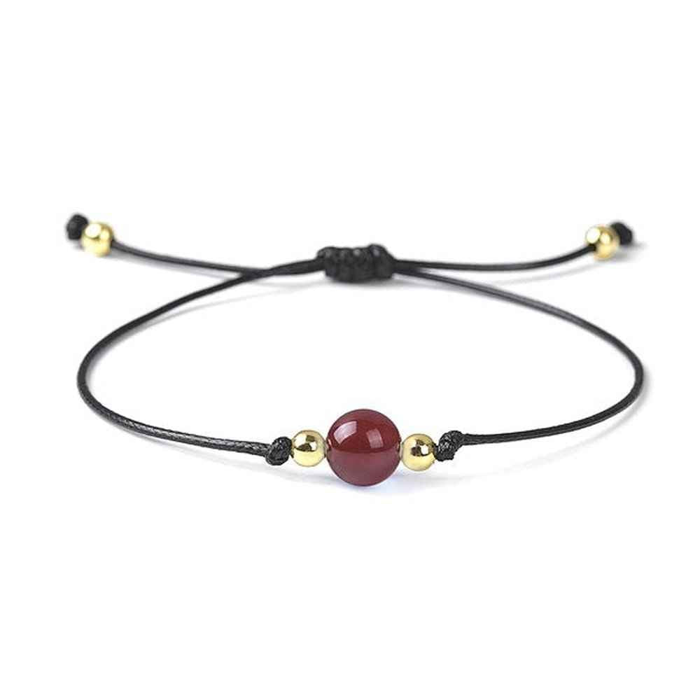Carnelian beaded bracelet in warm orange natural stone on a wax cord