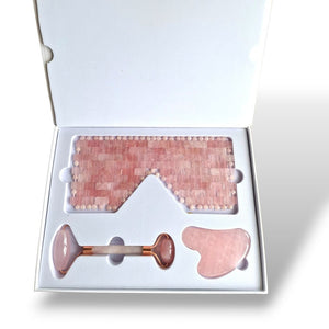 Rose quartz skincare set with a facial roller and eye mask