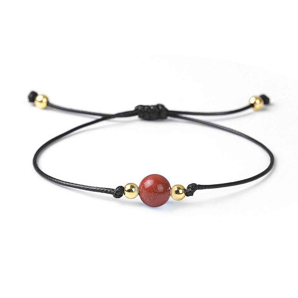 Red jasper beaded bracelet in brick red natural stone on a wax cord