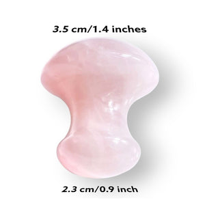 Rose Quartz Gua Sha tool, 3.5 cm by 2.3 cm, smooth pink surface for facial massage.